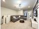 Cozy living room with a comfortable couch, contemporary lighting, and neutral color palette at 3878 Lana Ave, Davenport, FL 33897