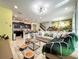Bright open concept living area featuring stylish décor and a dinosaur themed wall at 3878 Lana Ave, Davenport, FL 33897