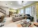 Bright, open-concept living area featuring stylish décor and a dinosaur themed wall at 3878 Lana Ave, Davenport, FL 33897