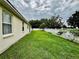 Beautiful backyard with well-maintained lawn and white fencing, creating a private outdoor oasis at 4368 Fox Glen Loop, Kissimmee, FL 34746