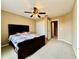 Spacious bedroom with a ceiling fan, carpeted floors and neutral paint color at 4368 Fox Glen Loop, Kissimmee, FL 34746