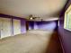 A spacious bonus room with carpet, two ceiling fans, and ample natural light at 4368 Fox Glen Loop, Kissimmee, FL 34746