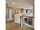 Upstairs hallway with neutral colored carpet and walls leads to other areas of the home at 4368 Fox Glen Loop, Kissimmee, FL 34746