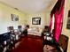 Living Room with wood floors, plush chairs, and a window with bright light at 4368 Fox Glen Loop, Kissimmee, FL 34746