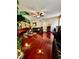 Spacious living room with hard wood flooring, ceiling fan, and ample seating at 4368 Fox Glen Loop, Kissimmee, FL 34746