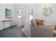 Bright entryway featuring tile floors, decorative door, and a view into the living area at 516 Millifiora Ln, Kissimmee, FL 34759