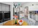 Well-equipped kitchen with stainless steel appliances and convenient laundry area at 516 Millifiora Ln, Kissimmee, FL 34759