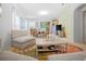 Bright living space showcasing an open layout with comfortable seating and a connected dining area at 516 Millifiora Ln, Kissimmee, FL 34759