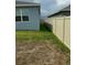 View of a backyard, showcasing the fence and grassy area at 522 Feltrim Manor Rd, Haines City, FL 33844
