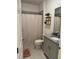 Bathroom featuring granite countertop, modern fixtures, and a tiled shower at 522 Feltrim Manor Rd, Haines City, FL 33844