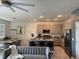 Open-concept kitchen with a breakfast bar, stainless steel appliances, and granite countertops at 522 Feltrim Manor Rd, Haines City, FL 33844