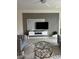 Stylish living room featuring a modern accent wall, elegant seating, and contemporary decor at 522 Feltrim Manor Rd, Haines City, FL 33844