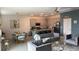 Open-concept kitchen and living room area with a dining table and modern furniture at 522 Feltrim Manor Rd, Haines City, FL 33844