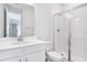 Bright bathroom featuring a glass-enclosed shower, vanity, and white tile at 530 Summit River Dr, Apopka, FL 32712