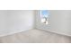 Cozy bedroom featuring neutral carpet, base molding, and a single window providing natural light at 530 Summit River Dr, Apopka, FL 32712