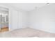 Neutral bedroom with plush carpeting, large closet, and adjacent bathroom entrance at 530 Summit River Dr, Apopka, FL 32712