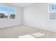Bright bedroom filled with natural light from two windows and plush carpeting at 530 Summit River Dr, Apopka, FL 32712