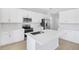 Spacious kitchen with an island, modern stainless steel appliances, and ample cabinet space at 530 Summit River Dr, Apopka, FL 32712