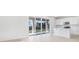 Open-concept kitchen and dining area with a large sliding glass door that leads to a patio at 530 Summit River Dr, Apopka, FL 32712