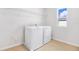 Laundry room with new white washer and dryer, light-colored walls and a window at 530 Summit River Dr, Apopka, FL 32712