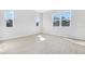 Bright living room featuring tile floors and plenty of natural light from large windows at 530 Summit River Dr, Apopka, FL 32712