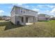 The backyard is complemented by a covered patio, ideal for outdoor gatherings and leisure at 540 Summit River Dr, Apopka, FL 32712