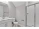 This bathroom features a walk-in shower, toilet, and vanity with neutral paint at 540 Summit River Dr, Apopka, FL 32712