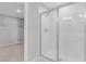 Bright bathroom showcasing a glass-enclosed shower with white tiles and modern fixtures at 540 Summit River Dr, Apopka, FL 32712