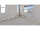 This bedroom features neutral paint and carpet, along with windows providing natural light at 540 Summit River Dr, Apopka, FL 32712