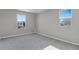 A bedroom features neutral carpet, and a window provides a glimpse of the neighborhood at 540 Summit River Dr, Apopka, FL 32712