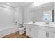 Full bathroom with double sink vanity, bathtub with shower, and modern fixtures that create a luxurious feel at 545 Summit River Dr, Apopka, FL 32712