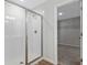 Shower stall that features white subway tiles and glass door with the entrance to the walk-in closet nearby at 545 Summit River Dr, Apopka, FL 32712