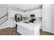 A modern kitchen with white cabinets, stainless appliances, and a center island at 545 Summit River Dr, Apopka, FL 32712