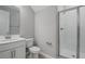 Clean bathroom with a walk-in shower, white cabinets, and a large mirror at 555 Summit River Dr, Apopka, FL 32712