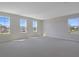 Large bedroom with neutral carpeting and lots of natural light from the three windows at 565 Summit River Dr, Apopka, FL 32712
