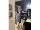 Bathroom boasts navy blue accent wall, gold fixtures, and tub with shower at 5930 Tivoli Gardens Blvd, Orlando, FL 32829