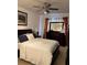 Comfortable bedroom with ceiling fan, dresser, and natural light at 5930 Tivoli Gardens Blvd, Orlando, FL 32829