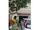 Charming two-story townhome with a red tile roof and an attached one-car garage at 5930 Tivoli Gardens Blvd, Orlando, FL 32829