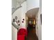 Bright foyer featuring a front door, staircase, and views into the living area at 5930 Tivoli Gardens Blvd, Orlando, FL 32829
