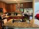 Spacious kitchen featuring cherry cabinets, granite countertops, and stainless steel appliances at 5930 Tivoli Gardens Blvd, Orlando, FL 32829
