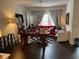 Inviting living room features dark wood floors and bright natural light at 5930 Tivoli Gardens Blvd, Orlando, FL 32829