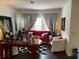 Inviting living room features dark wood floors and bright natural light at 5930 Tivoli Gardens Blvd, Orlando, FL 32829