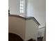 Stairway with a gray painted handrail and black frame window at 5930 Tivoli Gardens Blvd, Orlando, FL 32829