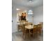 Cozy dining area with stylish lighting and a view into the kitchen at 615 Terra Lago St, Davenport, FL 33897