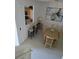 Open-concept dining area with a modern table and kitchen access at 615 Terra Lago St, Davenport, FL 33897