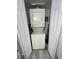 Convenient laundry area with stacked washer and dryer units in an enclosed space at 615 Terra Lago St, Davenport, FL 33897