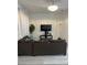 Spacious living room featuring a large television and comfortable seating arrangement at 615 Terra Lago St, Davenport, FL 33897