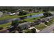 Aerial view capturing a cozy home with a canal in the backyard providing serene water views at 624 Royal Palm Dr, Kissimmee, FL 34743