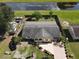 Aerial view of a property showcasing the backyard, landscaping, and proximity to a canal at 624 Royal Palm Dr, Kissimmee, FL 34743