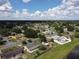 Overview of neighborhood featuring residential homes, tree coverage, and community landscape at 624 Royal Palm Dr, Kissimmee, FL 34743